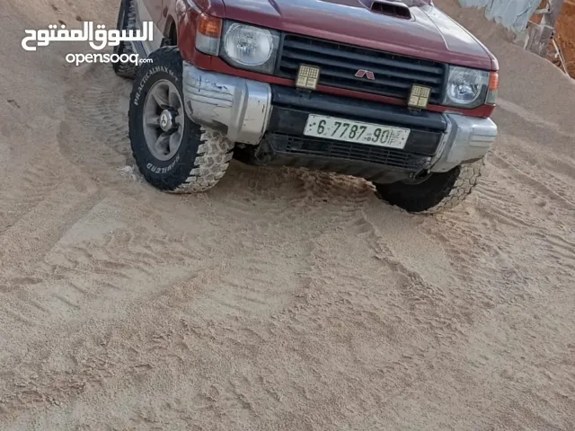 ميتسوبيشي باجيو1999  جير اتوماتيك 7 ركاب غرفه جلد عسليه  جير ومطور جاد مركبات