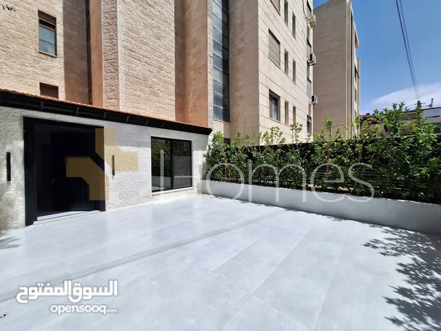 شقة ارضية مع ترس للايجار في الرابية بمساحة بناء 100م