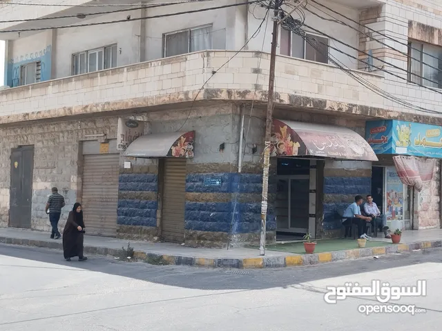 محلات تجارية على شارعين منطقة شارع الرشيد