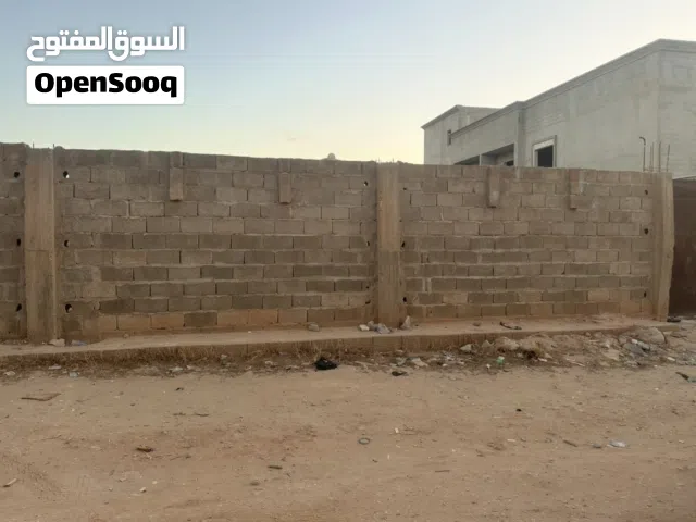 قطعة ارض ربع هكتار على شارعين طريق النهر (( شارع مول الحور للتسوق))