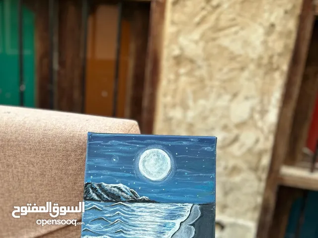 A painting of a night at the beach reflecting peacefulness and tranquility