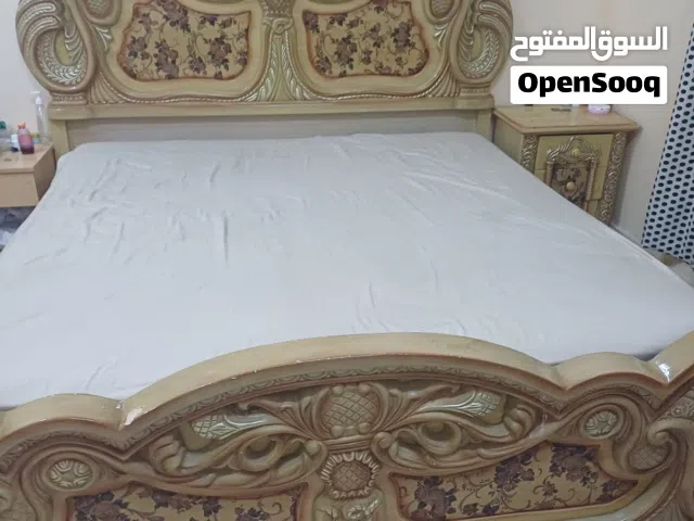 king size bed with dressing table and side tables