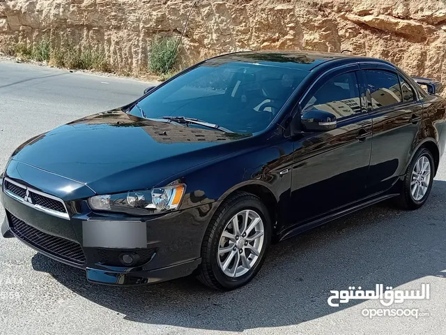 متسوبيشي لانسر فراشة موديل 2015 فحص مرفق مع الصور بحالة الوكاااااالة ماشية 49 الف km أصلي