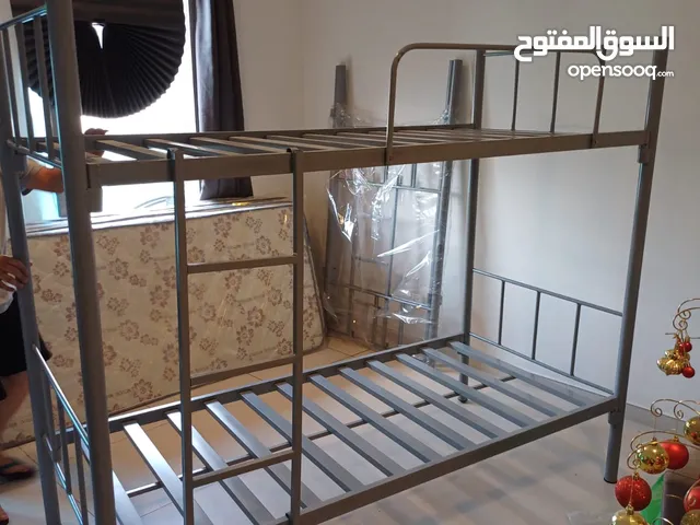 Brand new heavy-duty silver steel bunk bed for sale, size 190x90 cm, includes mattress.