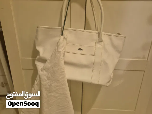 lacoste white bag with cover