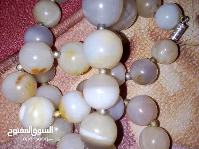 سنسال وتعليقة   حجر عقيق  اصلي  للبدل على مبايل او كاش