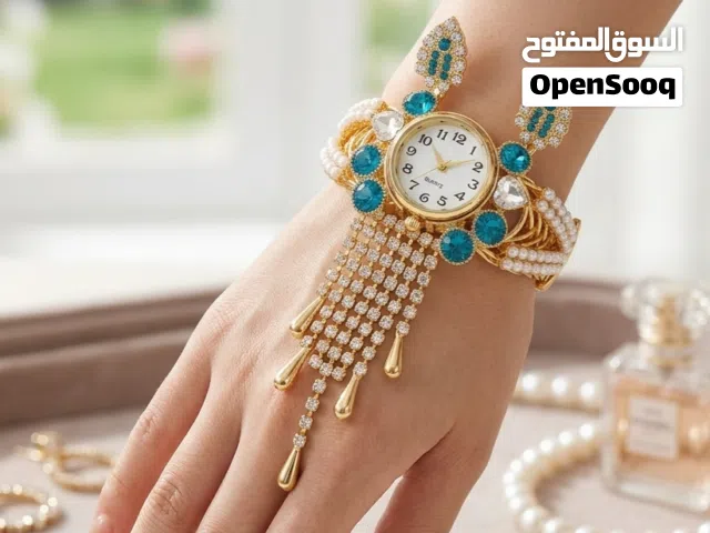 Luxury Gold Women Bracelet Watch with Blue Stones – Elegant Design