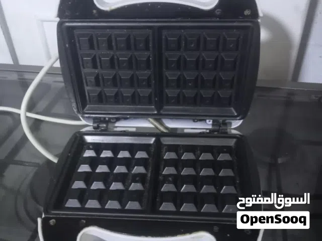 الطنجره الكهربائيه 35 اله الوافل ب 5 مجففه الخضروات 25 والخبازه 30