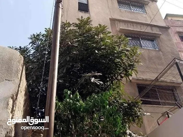 عمارة وارض للبيع
