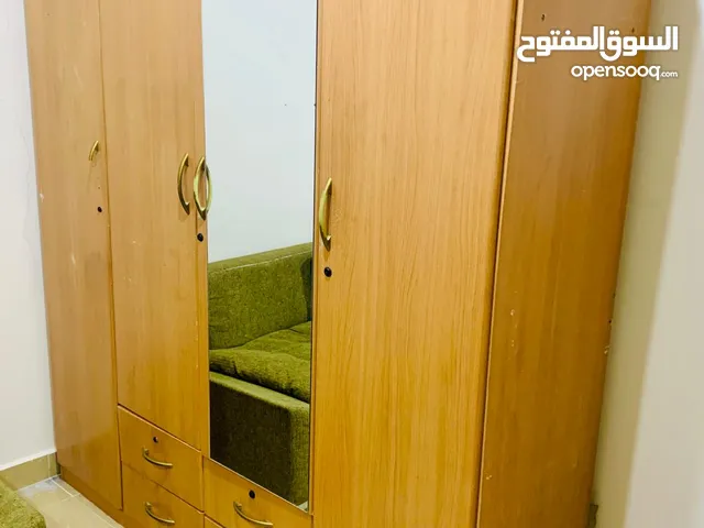 Modern 4 -door wooden wardrobe with mirror and drawers