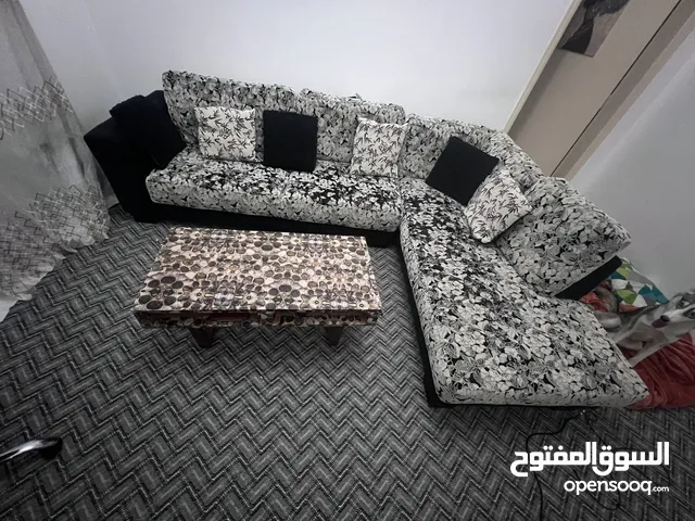 One L shape sofa with table