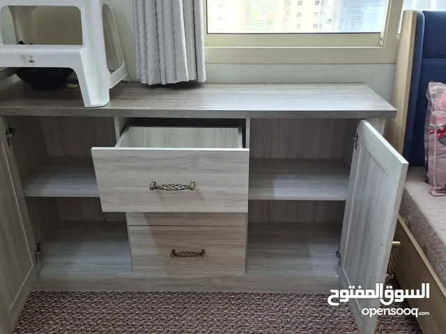 Side table with drawers and cupboard.