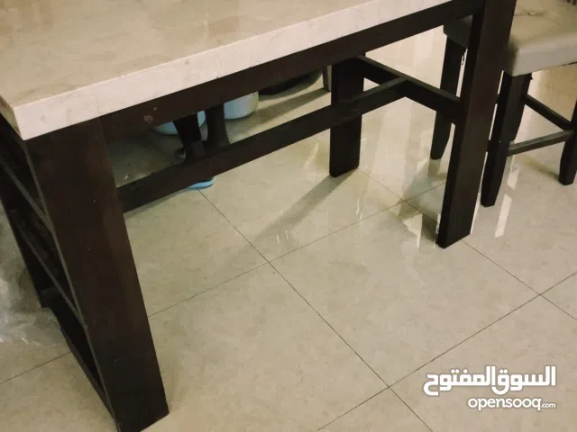 marble and wooden dinning table with 4 chairs for sale in good condition
