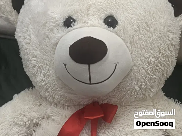 Big teddy bear with a frog