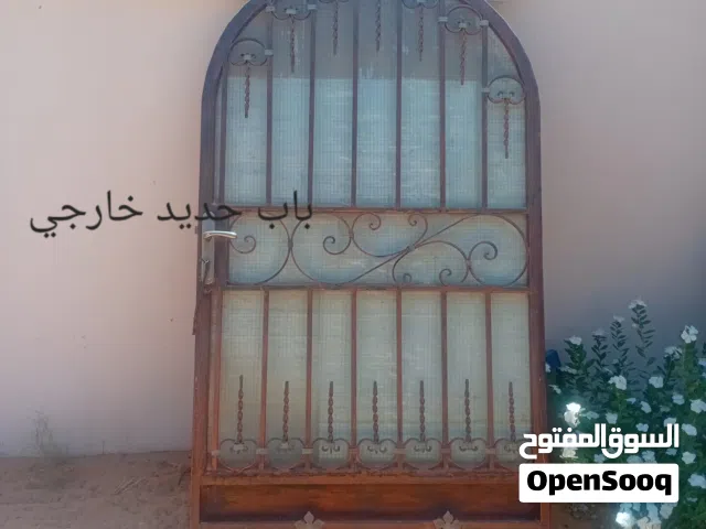 أبواب حديد ولوح وحديد مضلة بالقرميد