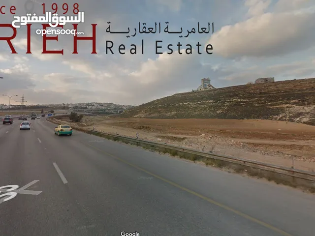 ارض مميزة للبيع في رجم عميش / اطلالة عالية على طريق المطار .