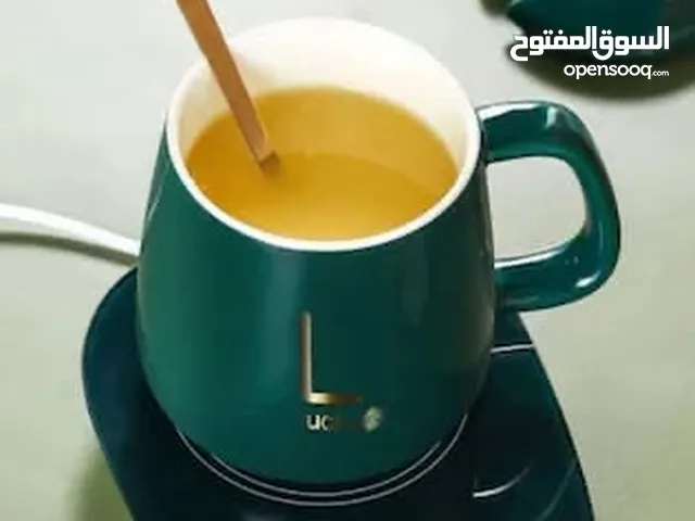 مج تسخين مع قاعدة مع معلقة ذهبية وغطاءبورسلان
