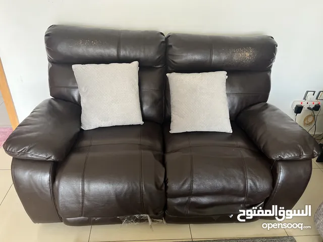 Recliner 2 seater sofa from danube , car bed with mattress 2 door wardrobe for sale in al khuwair
