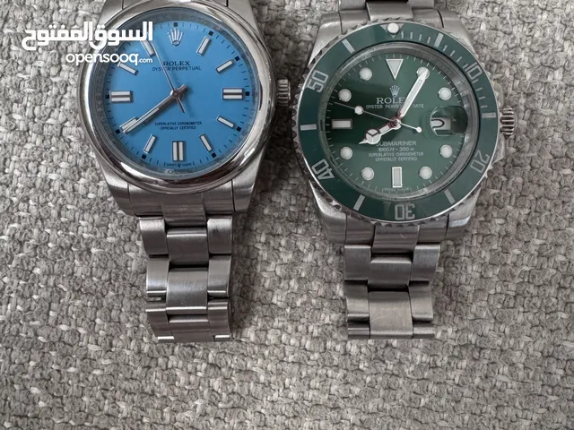 Rolex Submariner Green and oyster perpetual Blue