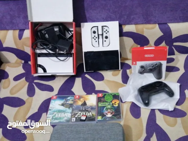 جهاز نينتيندو سويتش اولد الابيض مع 4 دسكات مستعملات و ذراع اصليه