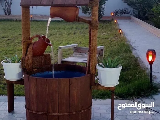 نوافير خشبية شكل بئر متنقلة يوجد توصيل حتى صلالة