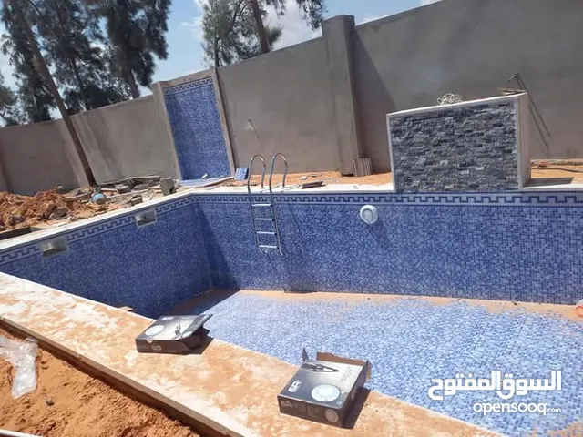 تجهيز احواض سباحه وتشطيب استراحات وبناء منازل وتعشيب حدائق