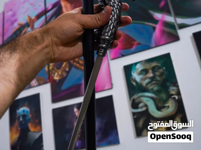 عوچية وسيف بنفس الوقت اناقة ومتانة قبضة على شكل رأس تنين