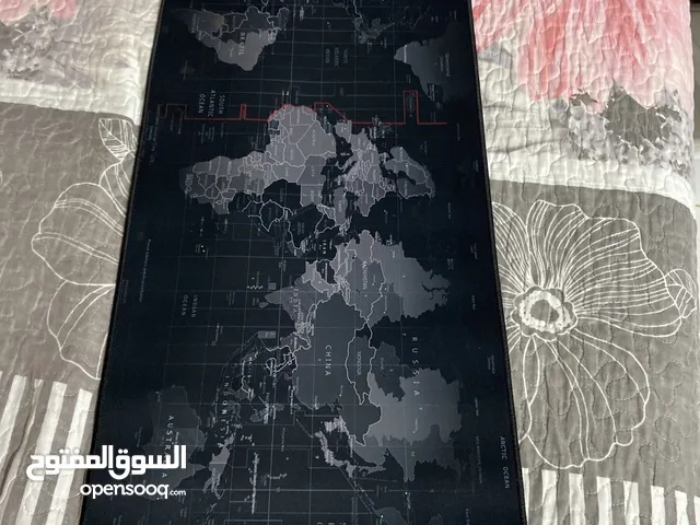 Table and monitor and gaming keyboard and mouse and mouse pad