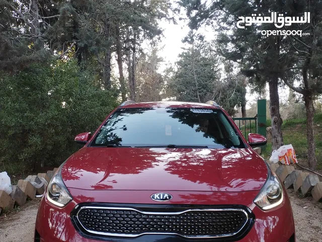 كيا نيرو لون احمر ميتالك مميز موديل 2018 جمرك جديد بحالة الوكالة