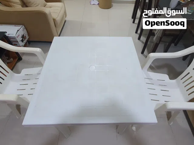 Plastic white table with chairs