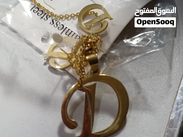 طعم سلسلة و اقراط ( حلق ) حرف D ذهبي