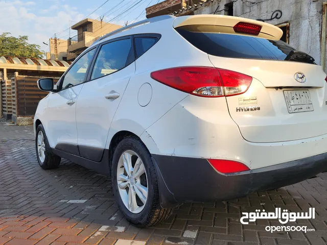 توسان خليجي موديل 2013 ابيض رقم بغداد بيع او مراوس بهايبرد عالية