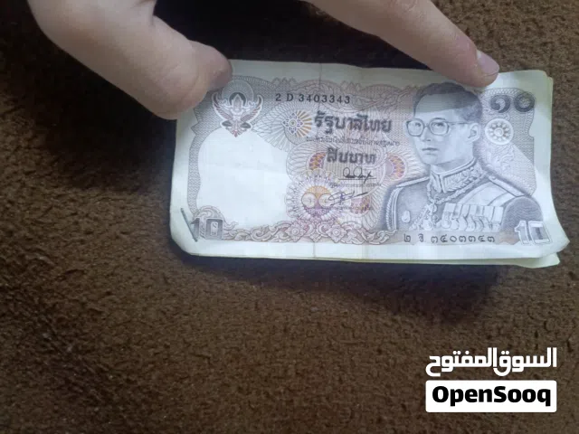 عدة عملات معدنيه قديمه تراثيه عراقي وكويتي وتليلاندي وتركي