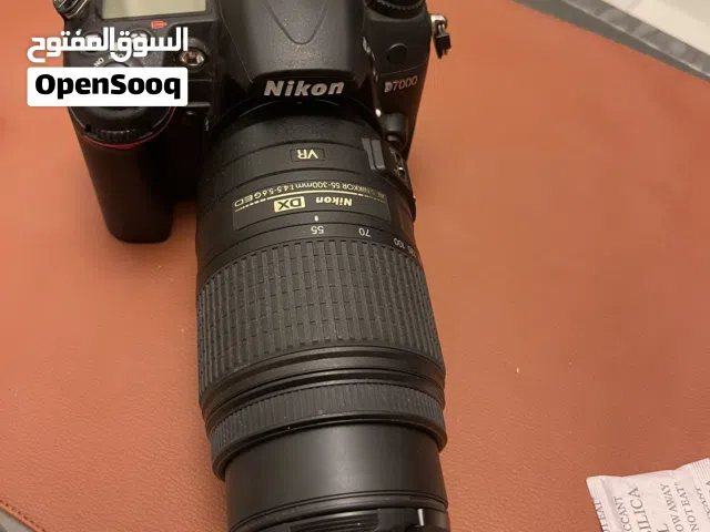 Nikon D7000 DSLR with Nikkor 55–300mm lens .professional camera with telephoto lens.