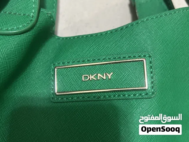 Almost new DKNY middle size handbag, elegant green color