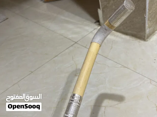 عصى عتم عمانية مطلية جزء بالفضة الصورية