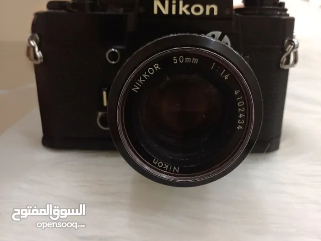 Nikon EM مع عدسة 50mm f/1.4 + فلاش Nissin  Tama M-900 Point &Shoot