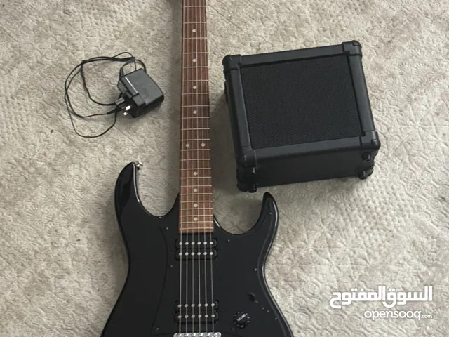 Ibanez Gio guitar + amp, excellent, 1000 Dhs. جيتار Ibanez Gio مع امبليفاير،حالة ممتازة،1000درهم