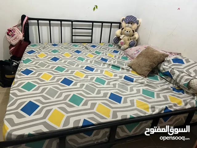 Bed with mattress, cupboard, washing machine
