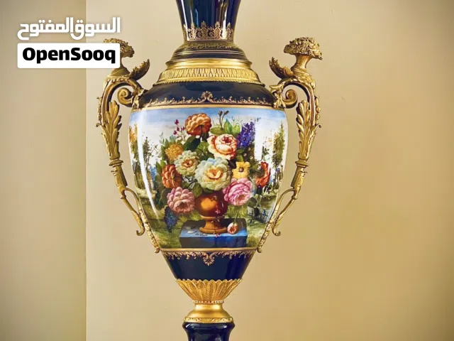 Masterfully Crafted Porcelain Cherub Vase with Artisan Bronze Accents