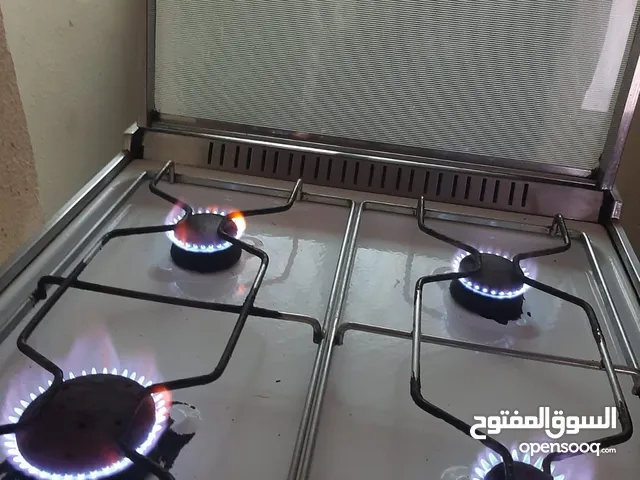 غاز يونفيرسال غير مجدد واللون ابيض 4 عيون