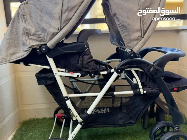 عرباية توؤم لون اسود القماش رمادي استخدام قليل شهر فقط