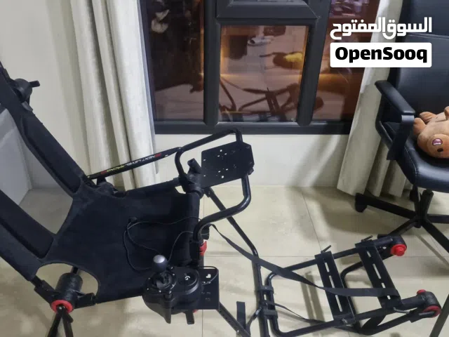 Next Level Racing FGTLite foldable racing chair with logitech shifter