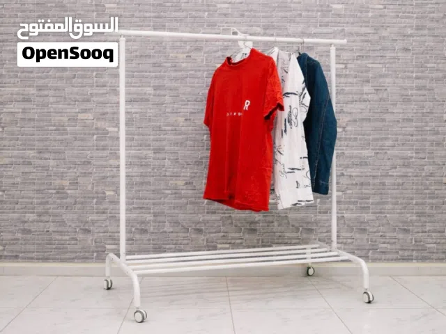 White IKEA RIGGA Adjustable Clothes Rack with WheelsAbu shagara