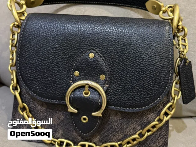 شنطة ماركة كوتش بني مميزة