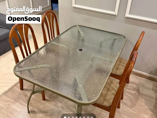 glass top dinning table with 4chairs price 300