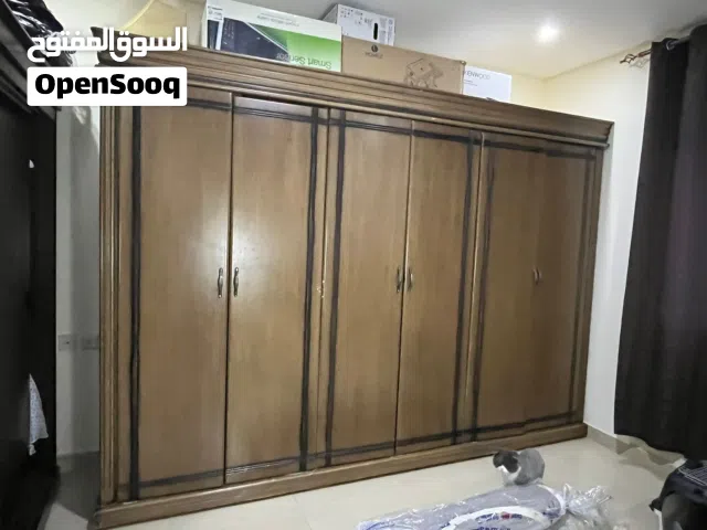 Large wooden wardrobe and carpets