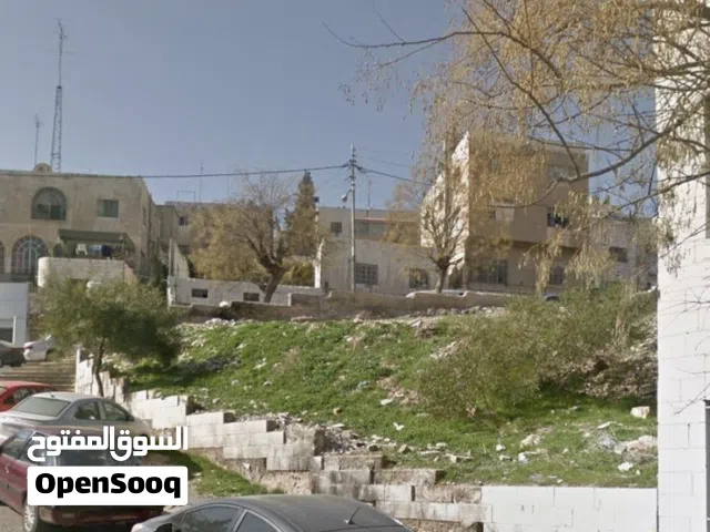 أرض في جبل الحسين تجارية على شوارع رئيسية للبيع