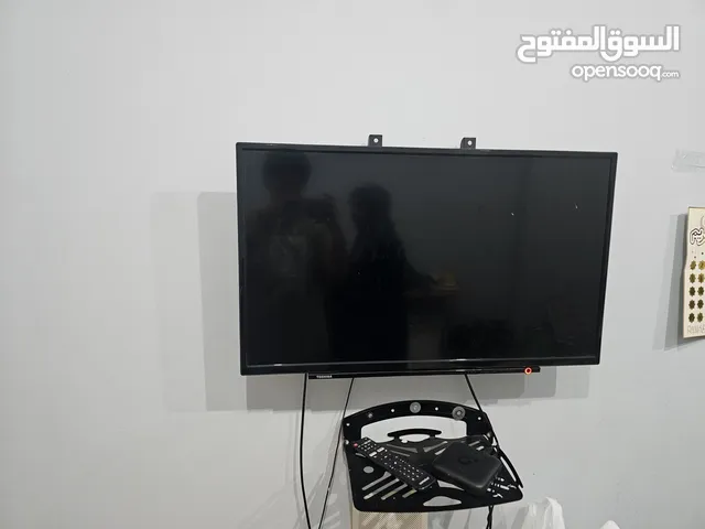 Toshiba t.v with stand in the wall