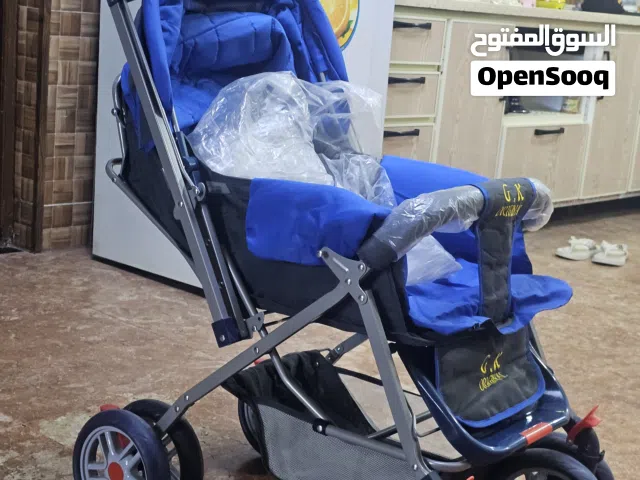 عربانة اطفال منام وجلوس تحتوي جيب خلفي وسلة مستلزمات واحزام امان